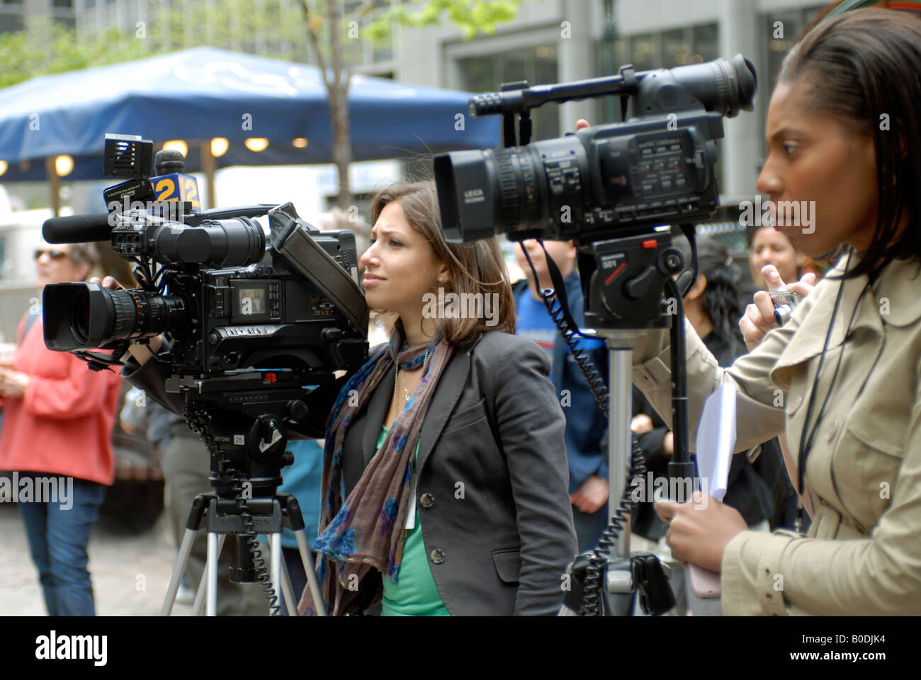 Le donne news cameramen Foto Stock