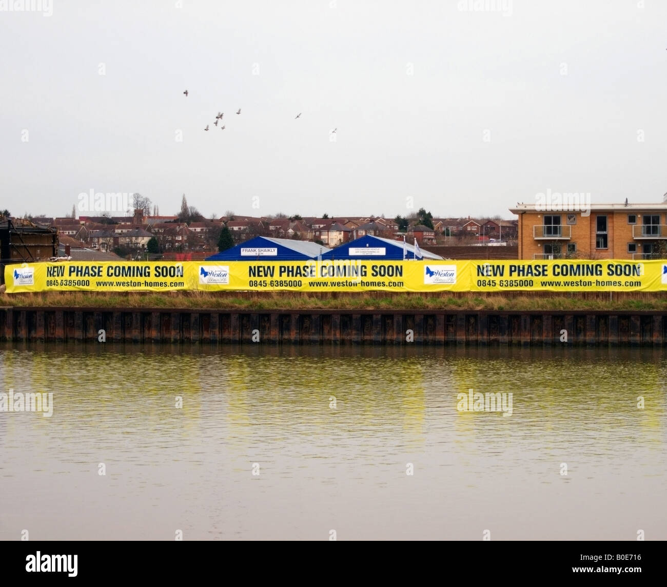 Sito di costruzione in attesa di riconversione in Riverside Apartments Colchester Docks Colchester Essex Foto Stock