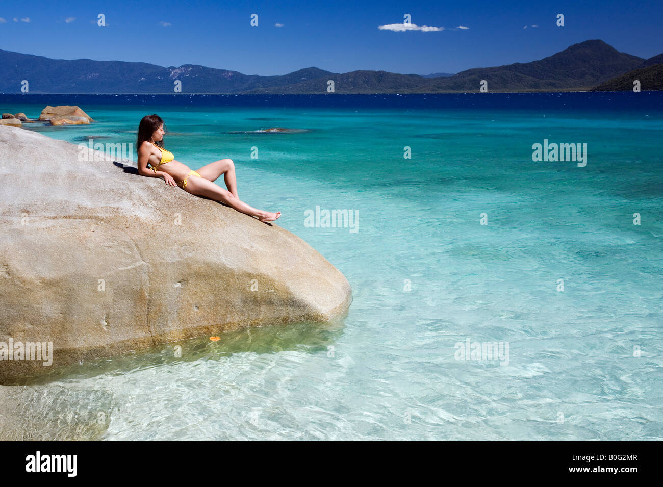 La donna a prendere il sole - Cairns, Queensland, Australia Foto Stock