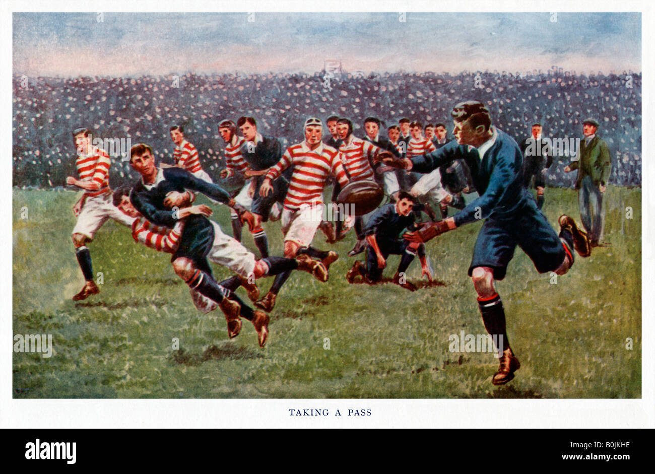 Prendendo un Pass 1920s ragazzi illustrazione annuale di azione di confronto in un ben frequentato il gioco del rugby Foto Stock