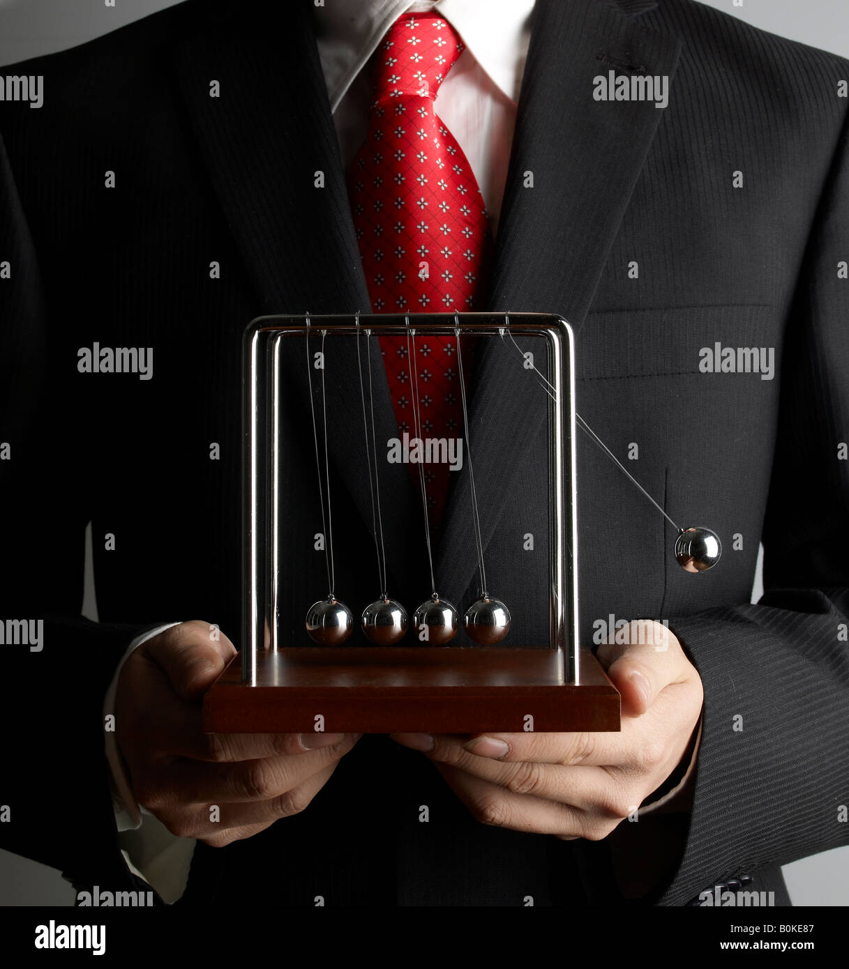 Imprenditore Azienda di Newton culla Foto Stock