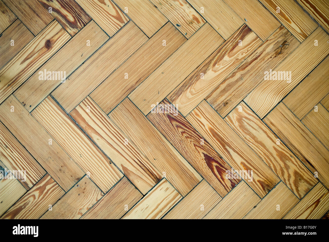 Pavimento in parquet di legno pattern. Unico motivo a spina di pesce Foto Stock