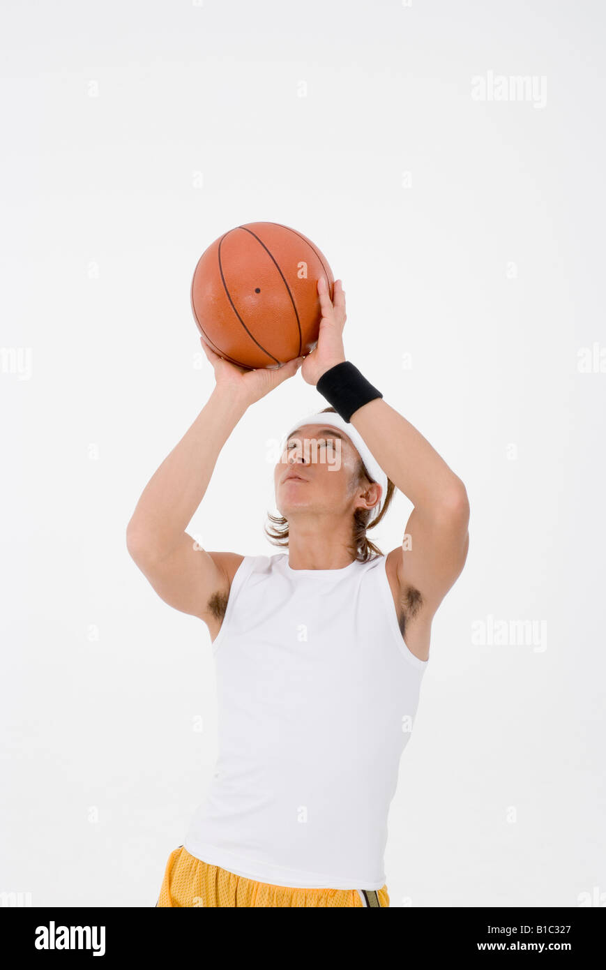 La pallacanestro di tiro del giocatore Foto Stock