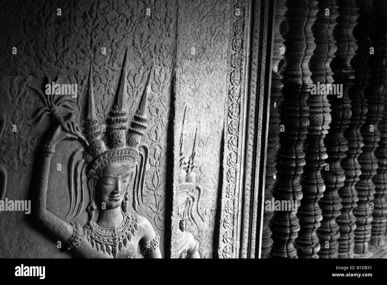 Incisioni su una parete in uno dei templi del complesso di Angkor a Siem Reap Cambogia Foto Stock