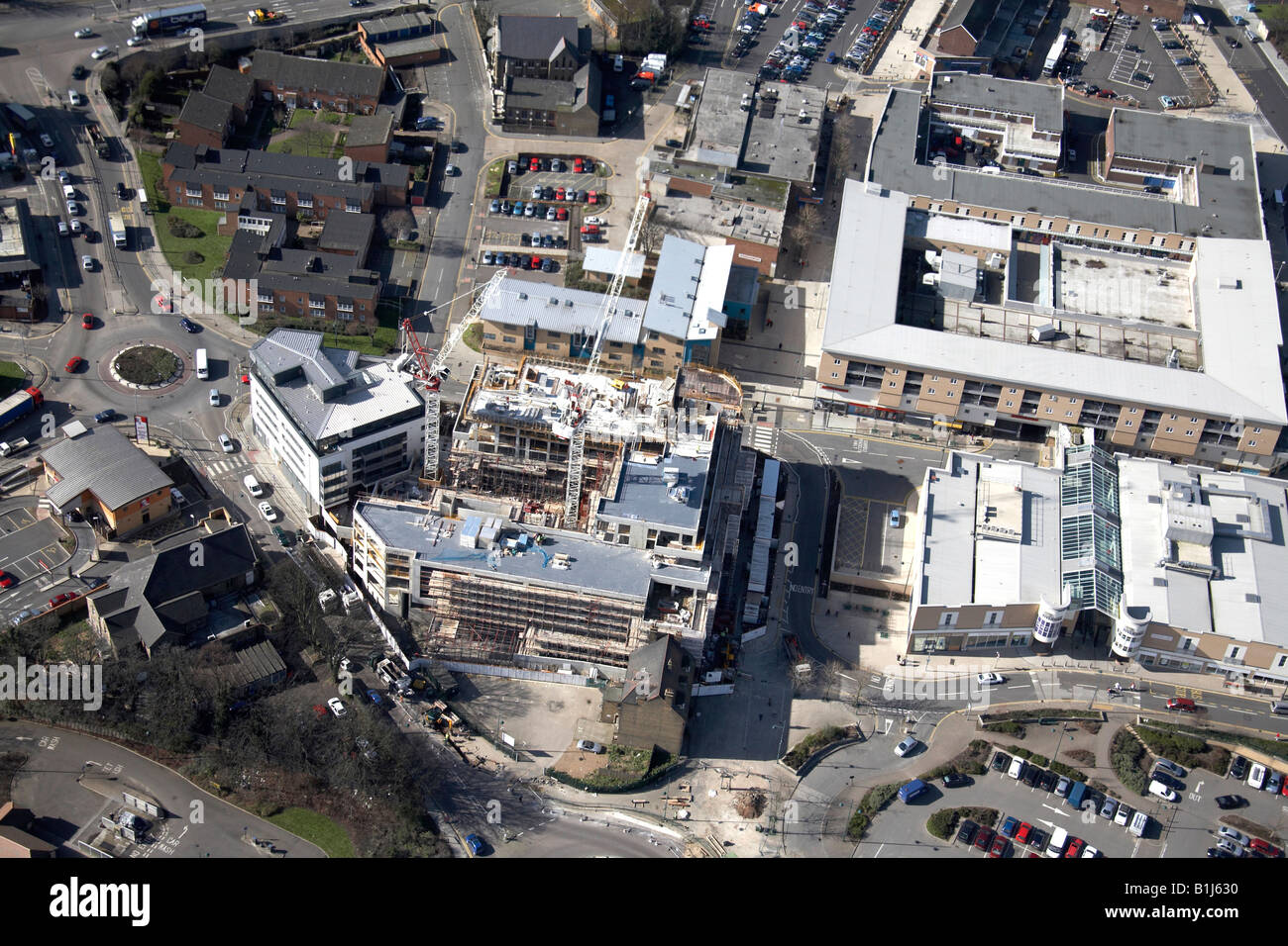 Vista aerea a sud-ovest di Erith alloggiamento suburbana e negozi edificio in costruzione Londra DA8 England Regno Unito alto livello obliqua Foto Stock