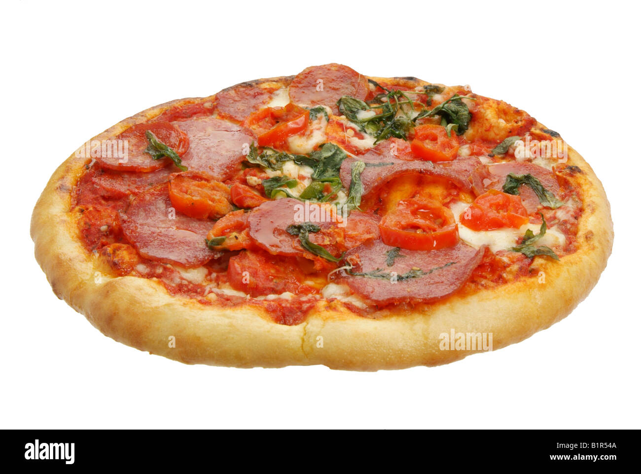 Una pizza con condimenti Foto Stock