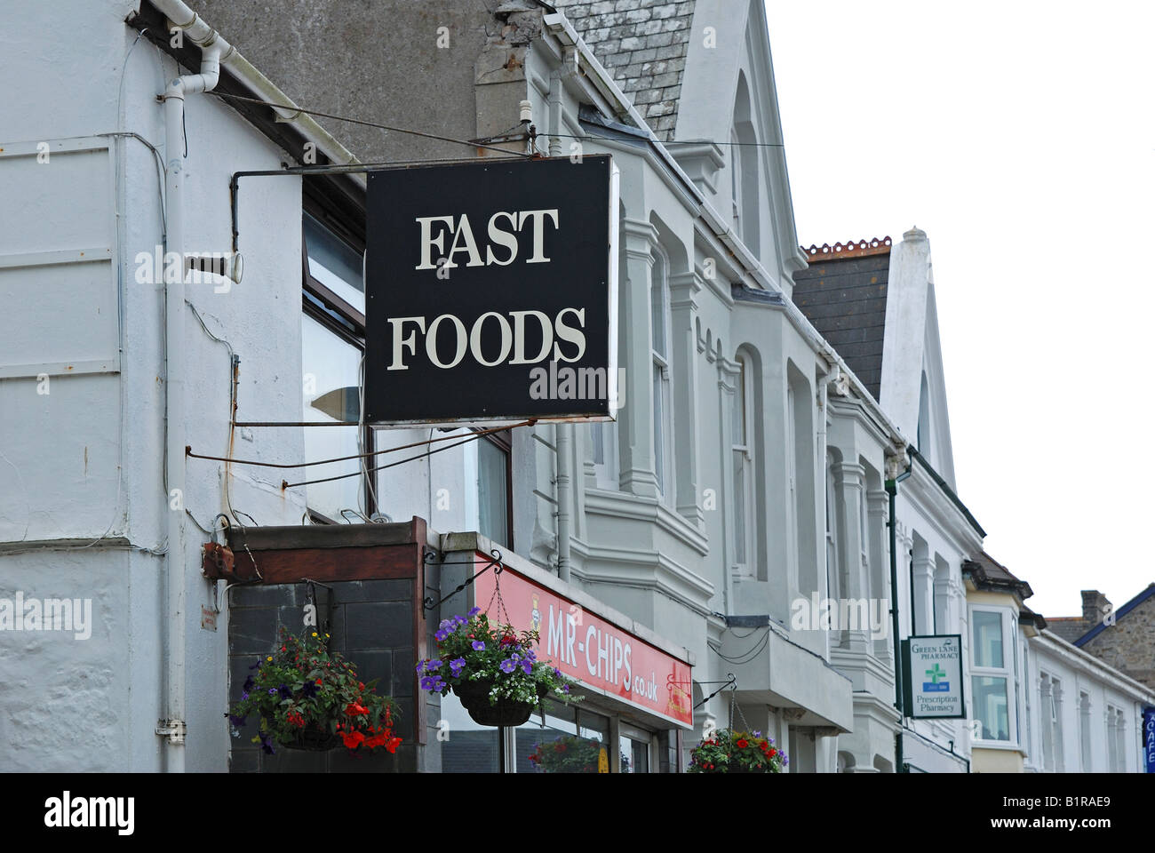 Un fast food segno al di fuori del negozio Foto Stock