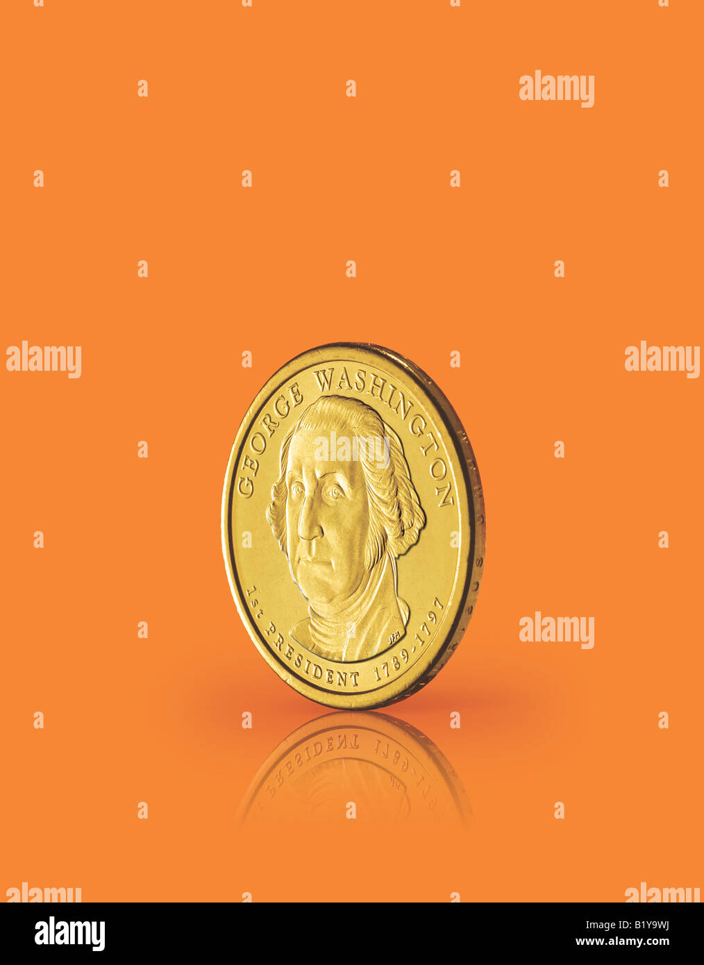 Un dollaro USA moneta su una superficie di colore arancione. Foto Stock