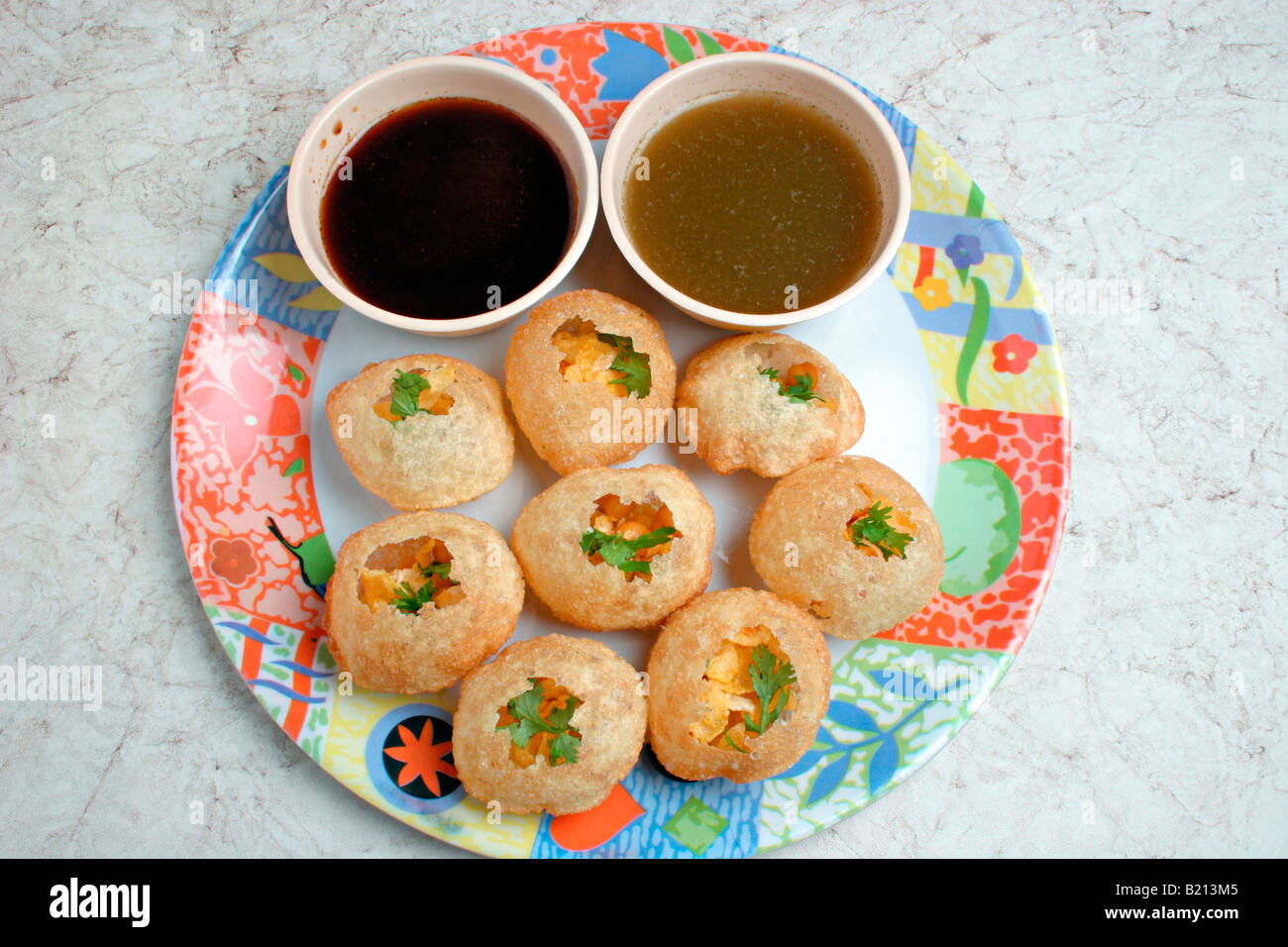 Primo piano di Pani puri (Indian spuntini). Foto Stock