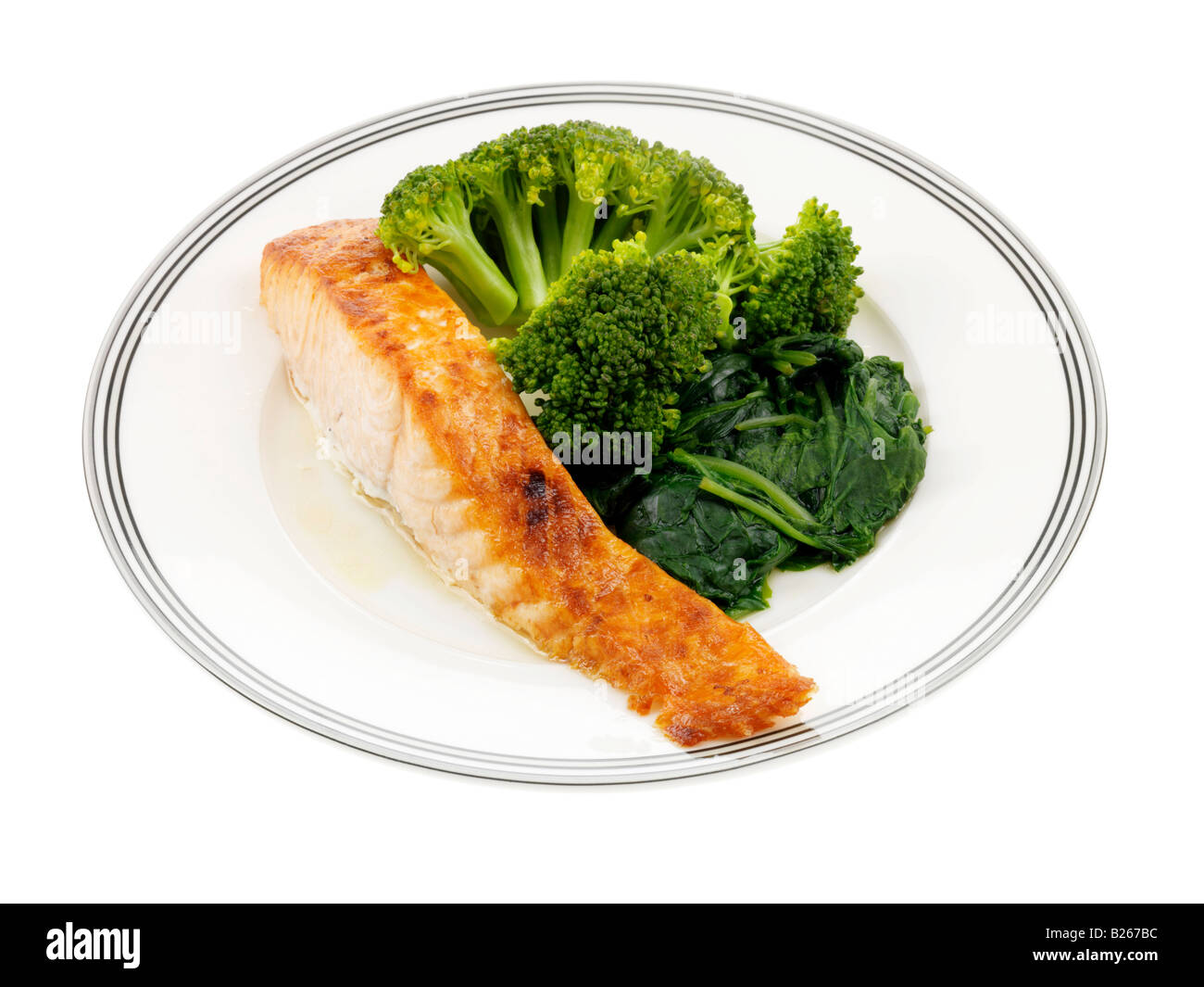 Filetto di salmone con broccoli e spinaci Foto Stock