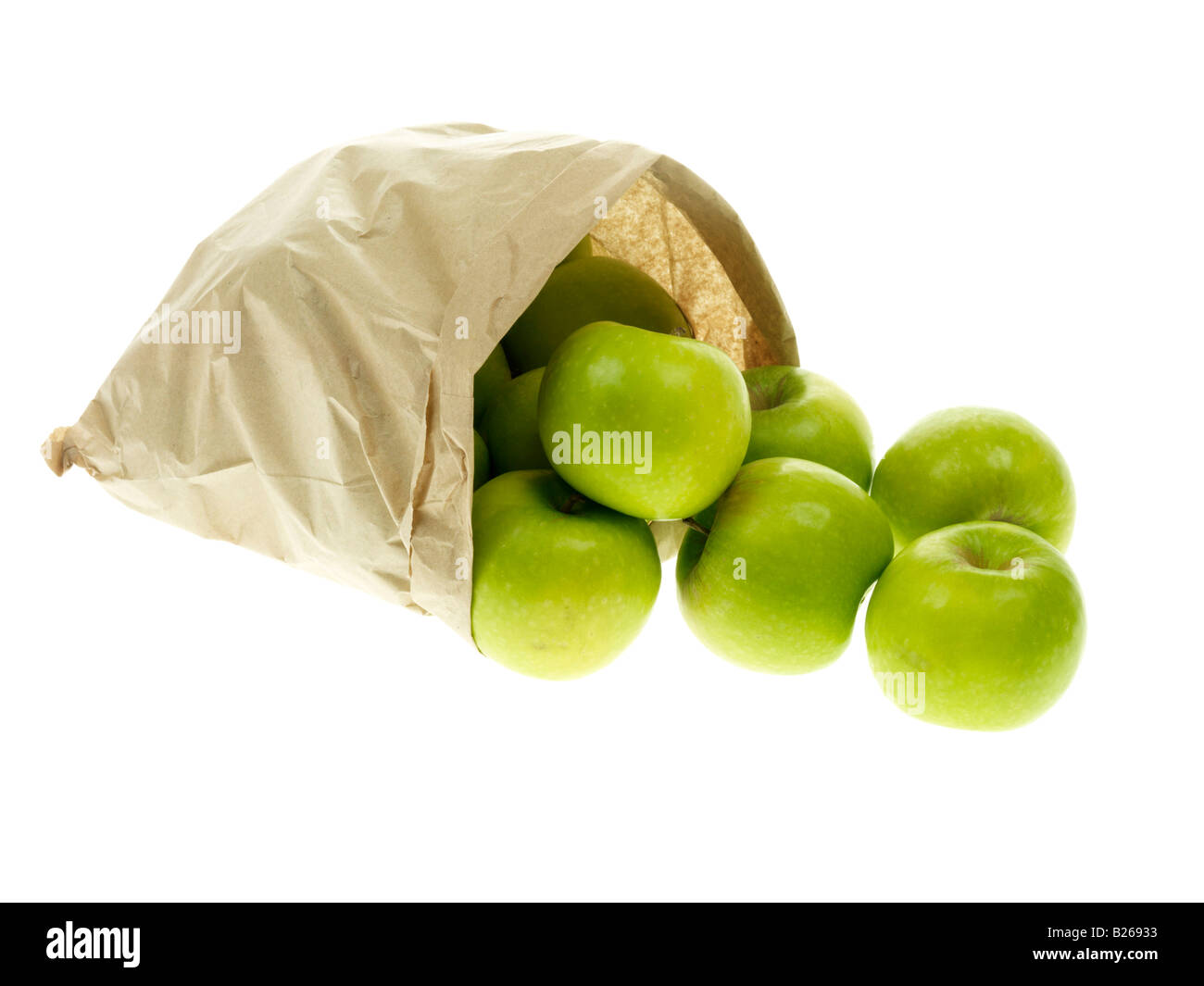 Carta marrone borsa, assenza di plastica, di sane mature le mele Granny Smith con spazio copia di un tracciato di ritaglio e nessun popolo contro uno sfondo bianco Foto Stock