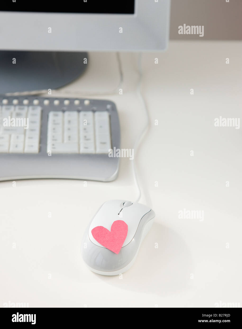Cuore sul mouse del computer Foto Stock