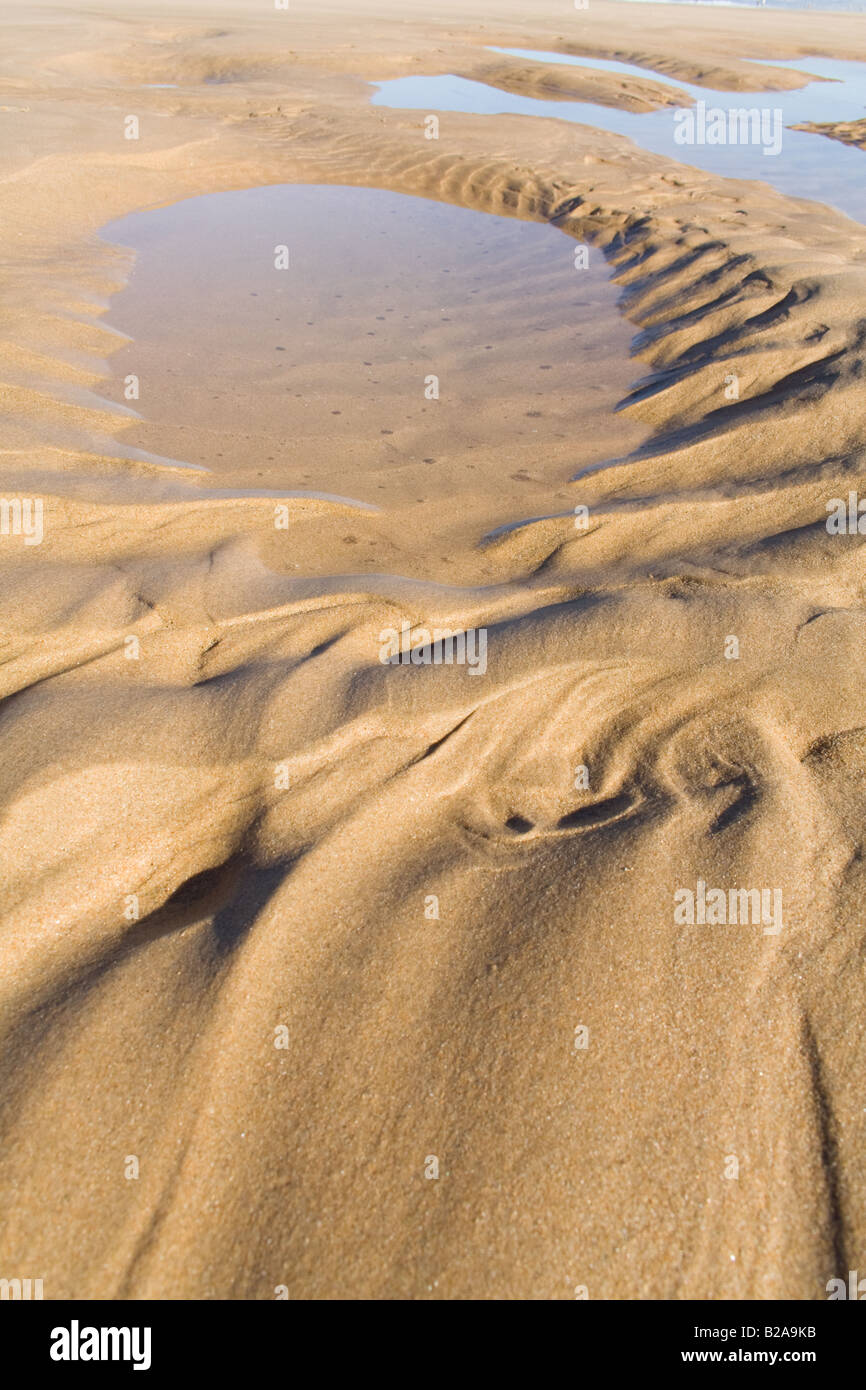 Increspature di sabbia in una spiaggia in estate Foto Stock