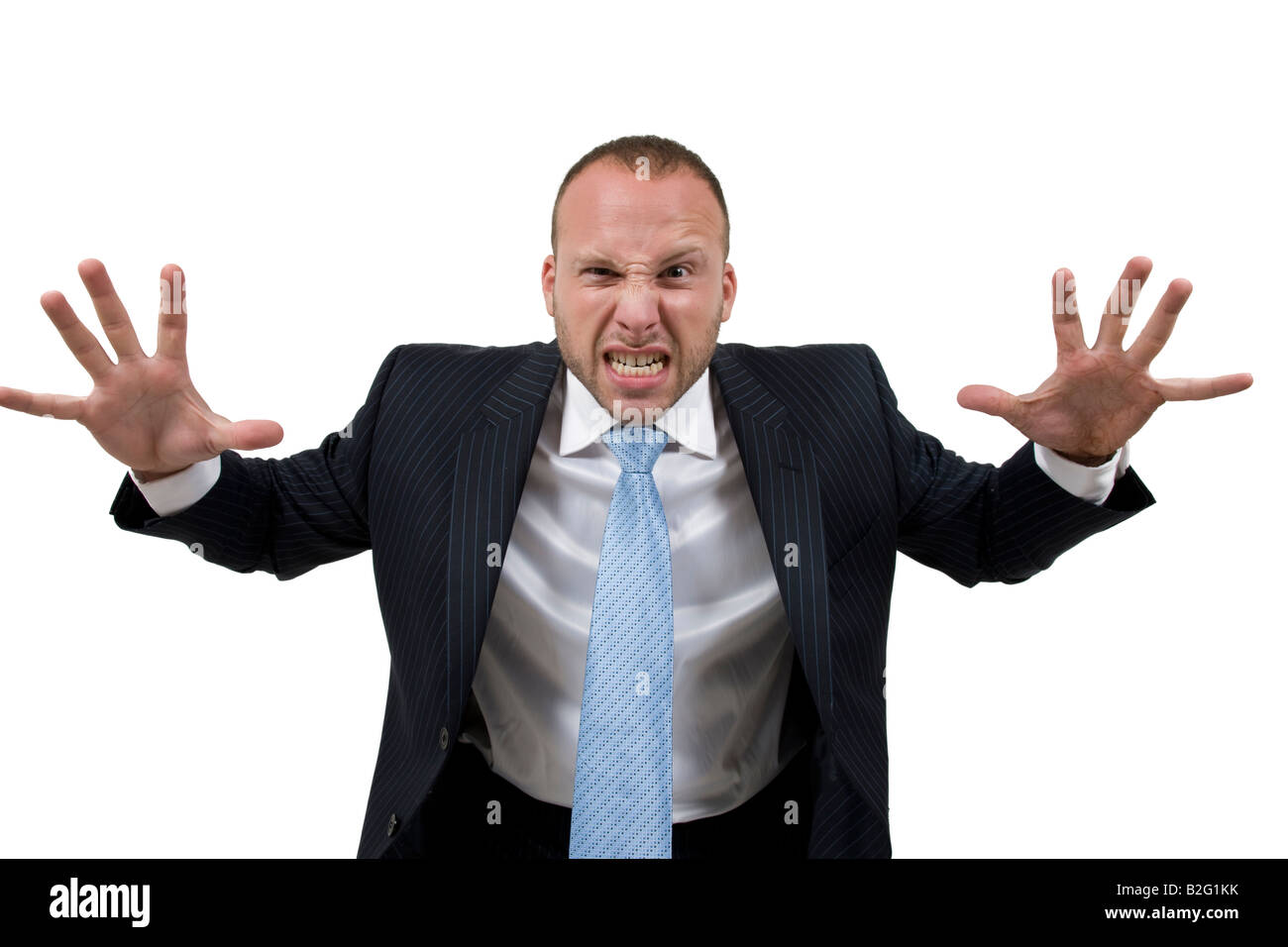 Urlando imprenditore tenendo le due mani fino a spaventare le persone mentre indossa una tuta di business Foto Stock