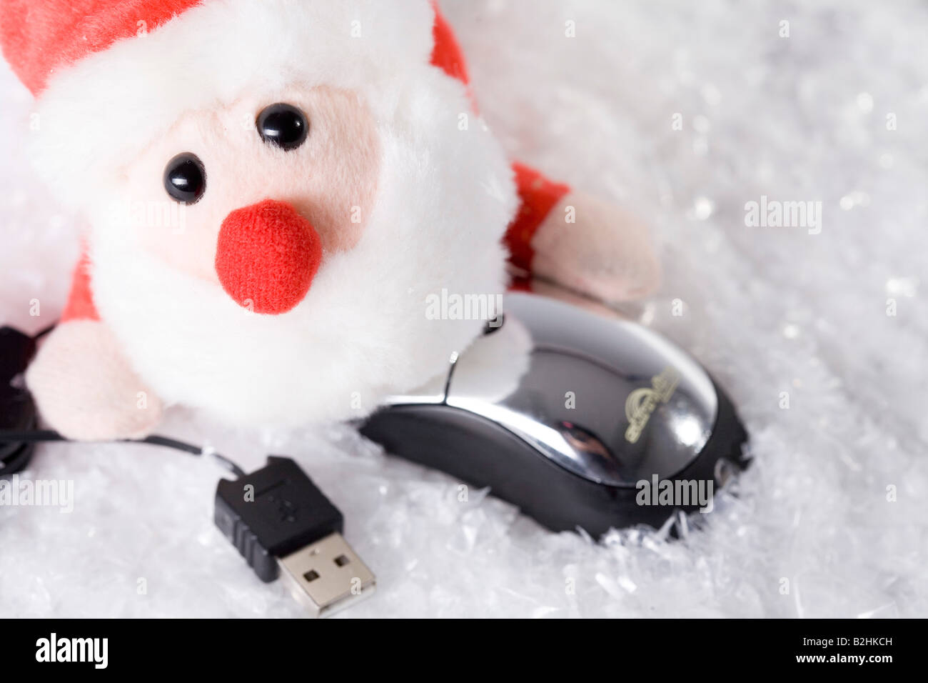 Toy babbo natale con il mouse del computer Foto Stock