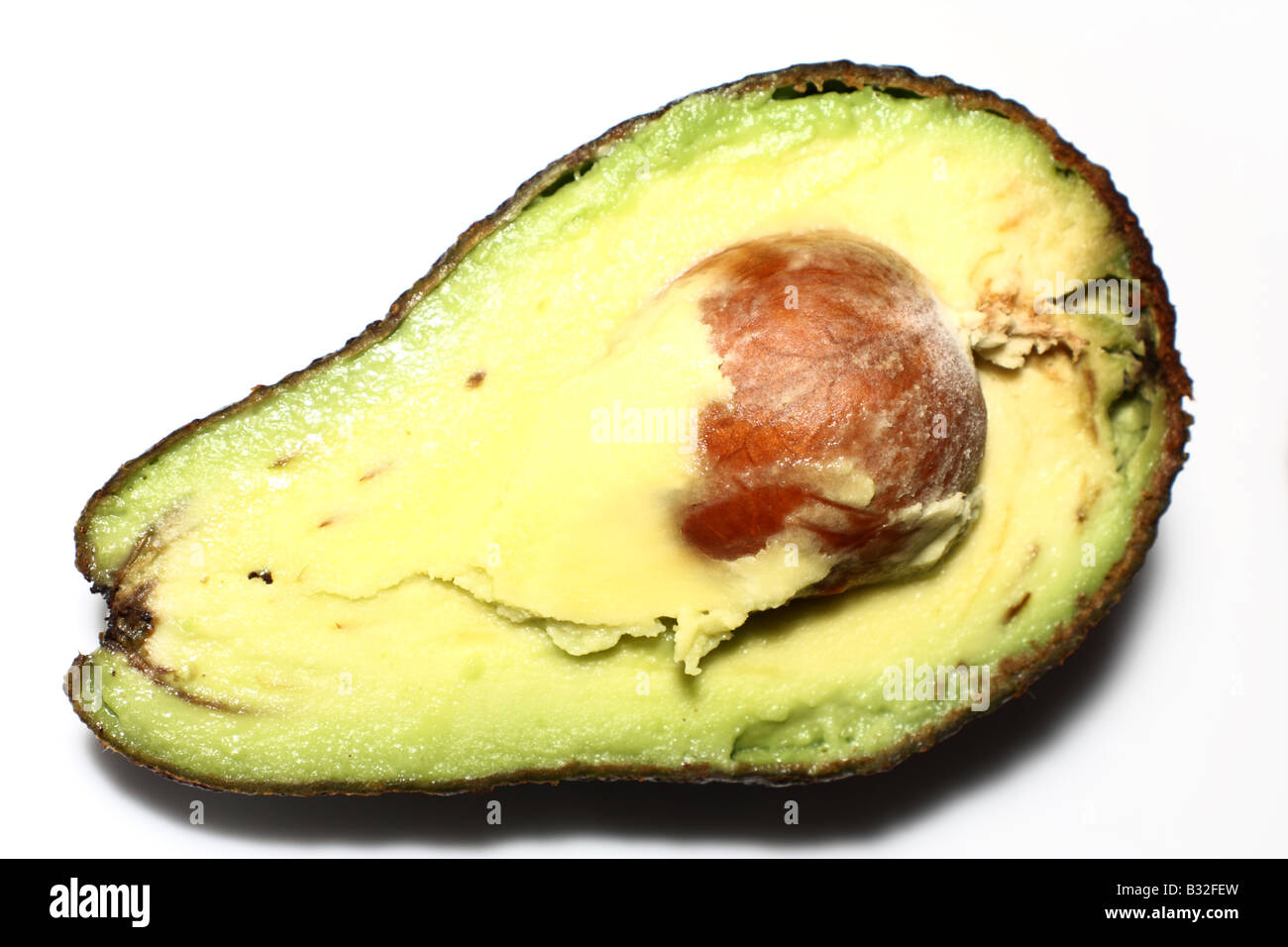 Tagliata aperta di Avocado con Pit Foto Stock