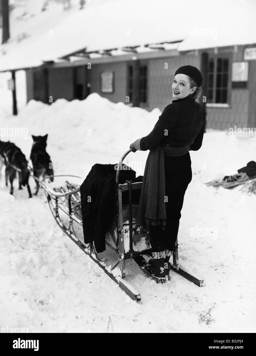 Donna su dogsled Foto Stock