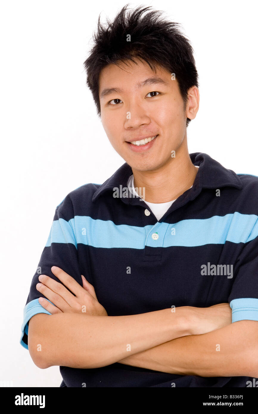 Un giovane e bello uomo cinese nel suo 20s Foto Stock