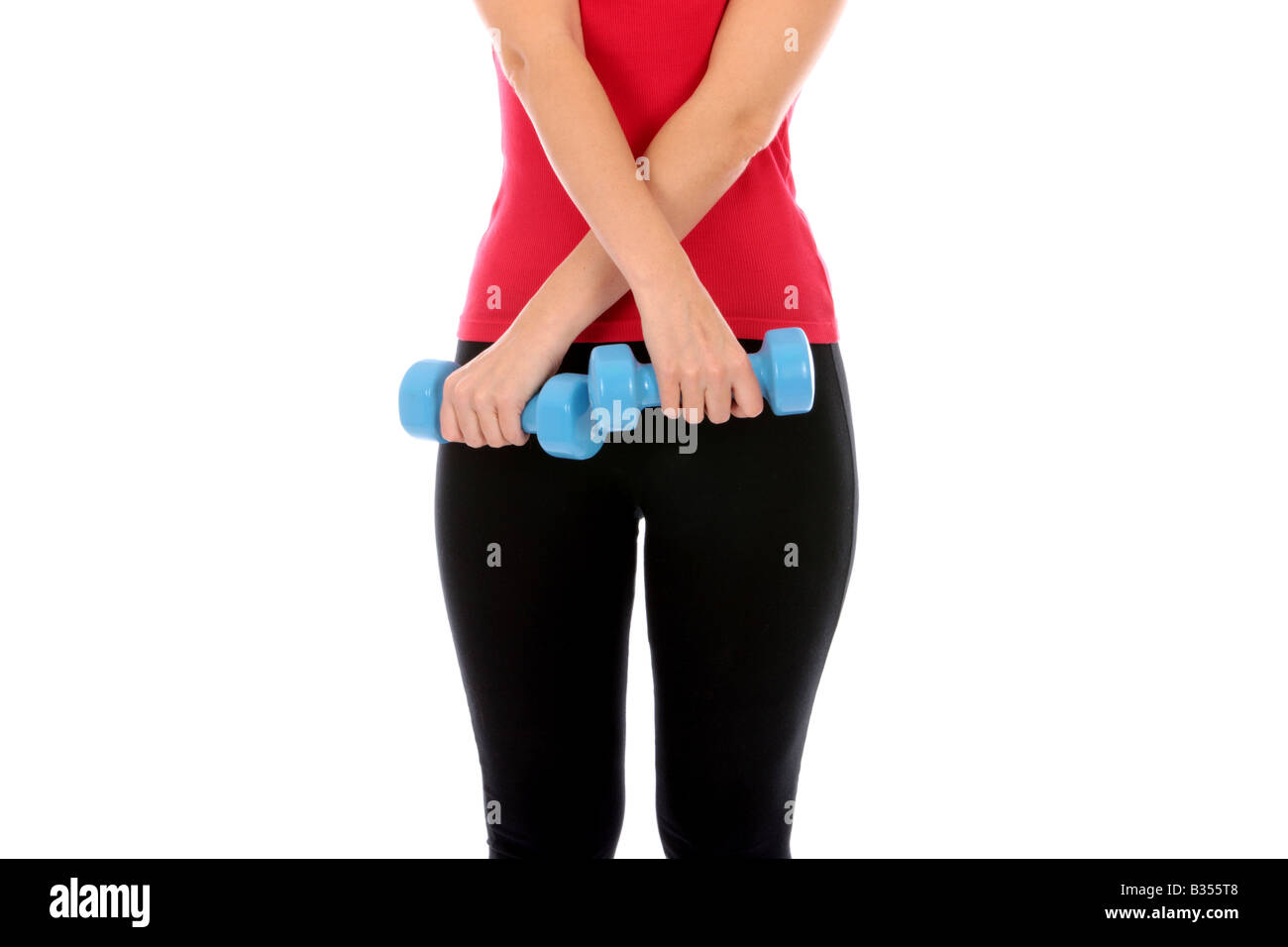 Giovane donna sollevamento pesi Modello rilasciato Foto Stock