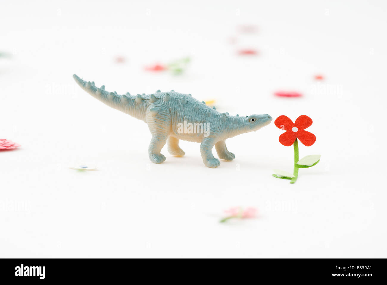 Dinosauro giocattolo profumati fiori artificiali Foto Stock