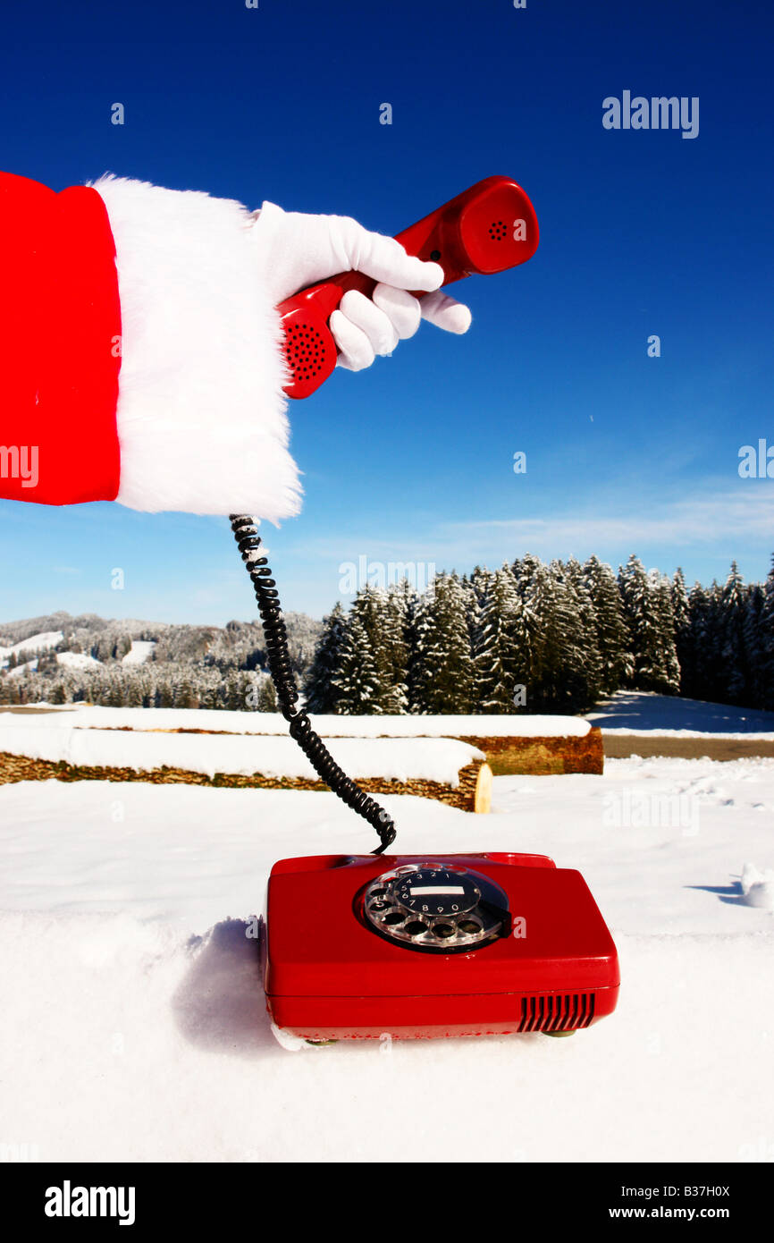 Santa Claus Hotline simboleggiato da un retro rosso telefono Foto Stock