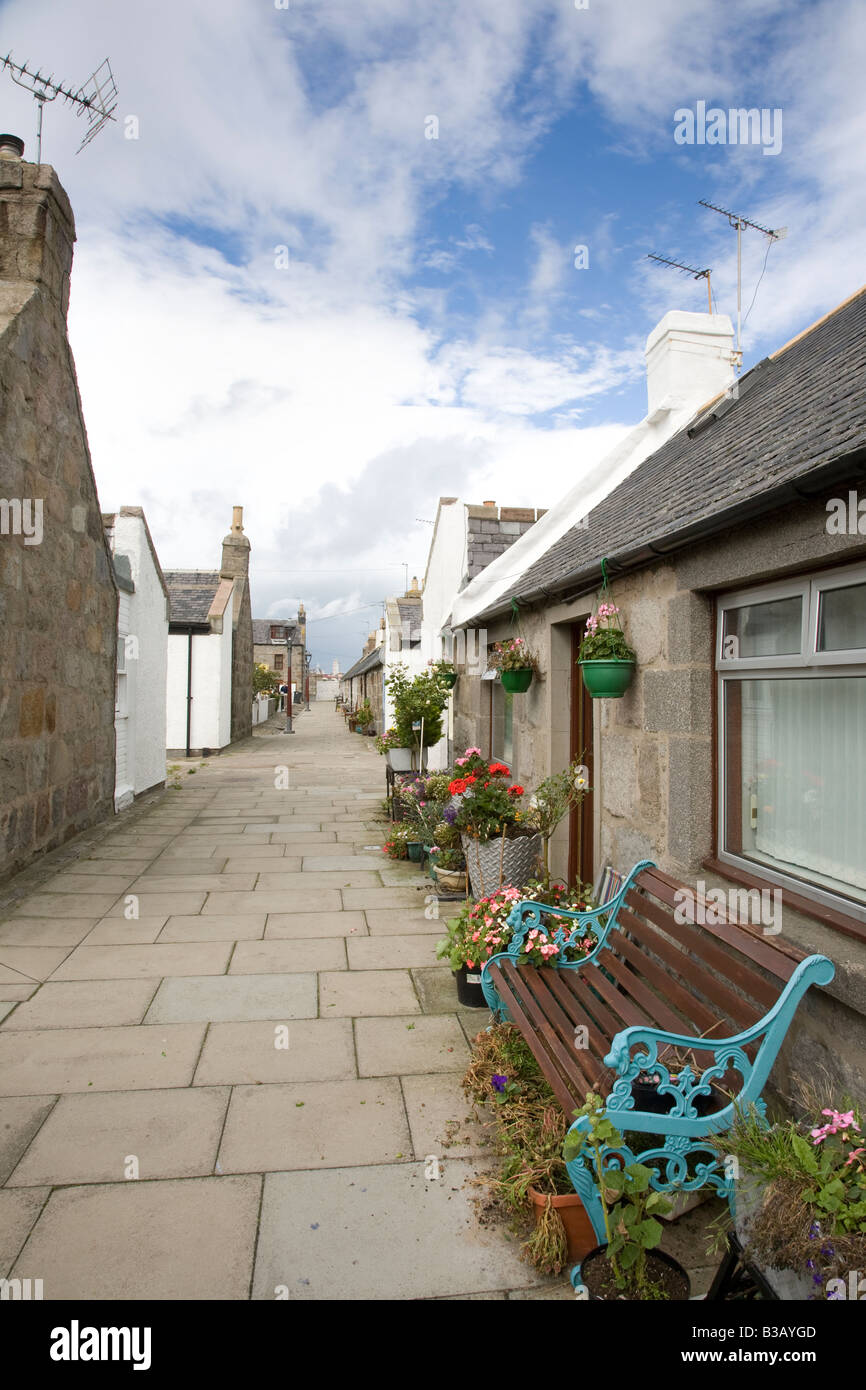 Case e giardini, capannoni in Footdee, St Fittick o Fittie, Aberdeen Scotland, Regno Unito. Fittie piazze, un modello di sistema di alloggiamento costruito per i pescatori in 1809. Foto Stock