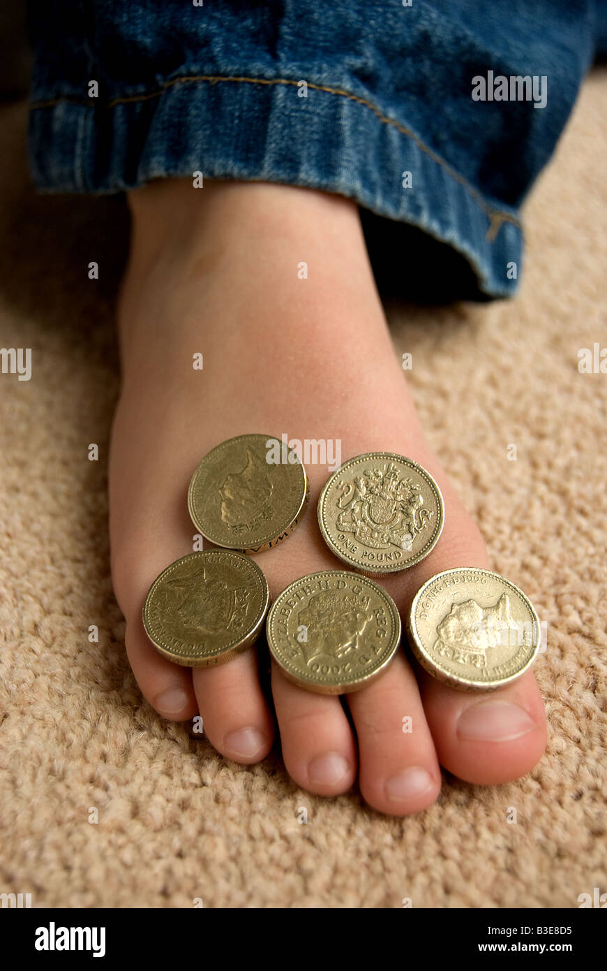 Soldi su un piede Foto Stock