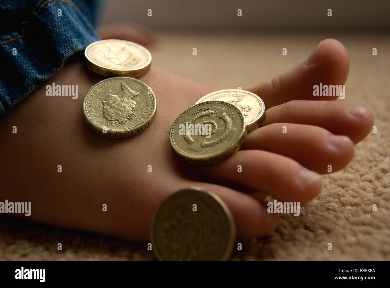 Soldi su un piede Foto Stock
