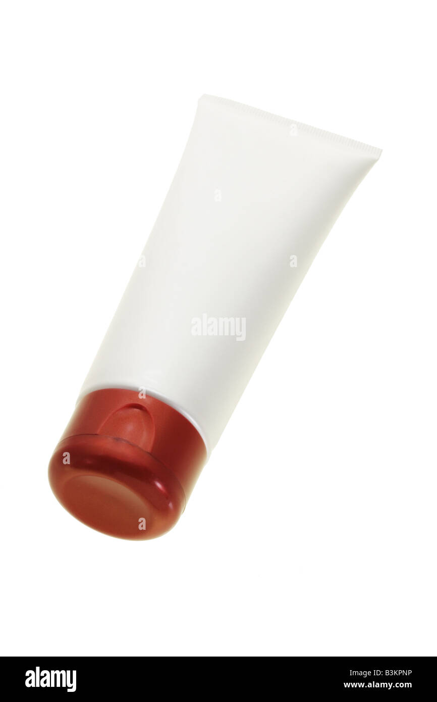Vuoto tubo di cosmetici in cremosa di colore bianco e cappuccio rosso Foto Stock