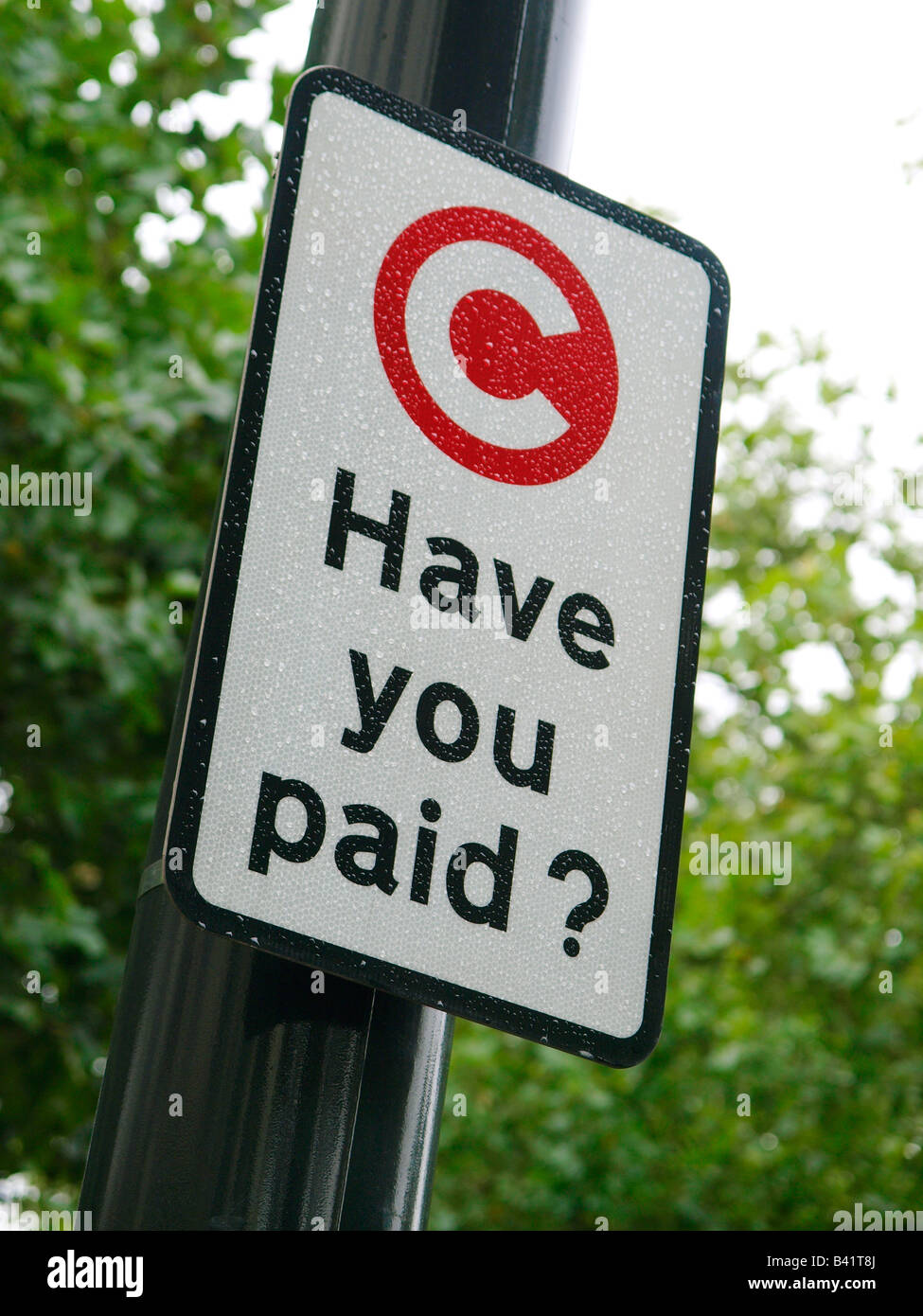 Avete pagato congestion zone entrata segno promemoria London REGNO UNITO Foto Stock