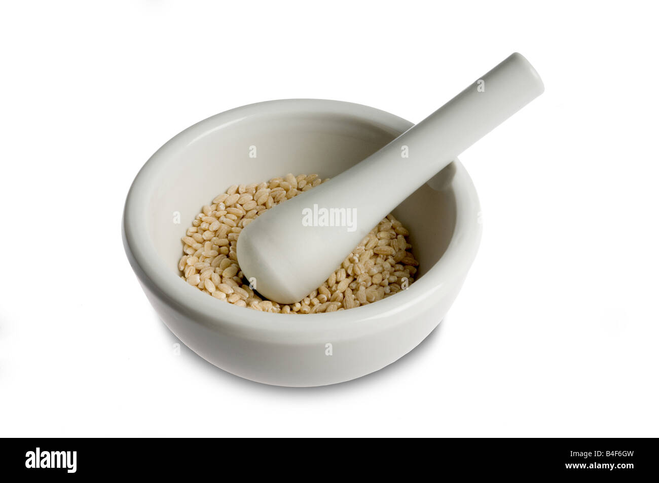 Orzo in un mortale con pestal Foto Stock