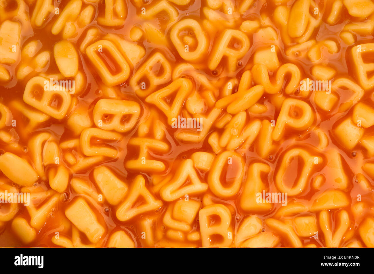 Sullo sfondo di un alfabeto di spaghetti Foto Stock