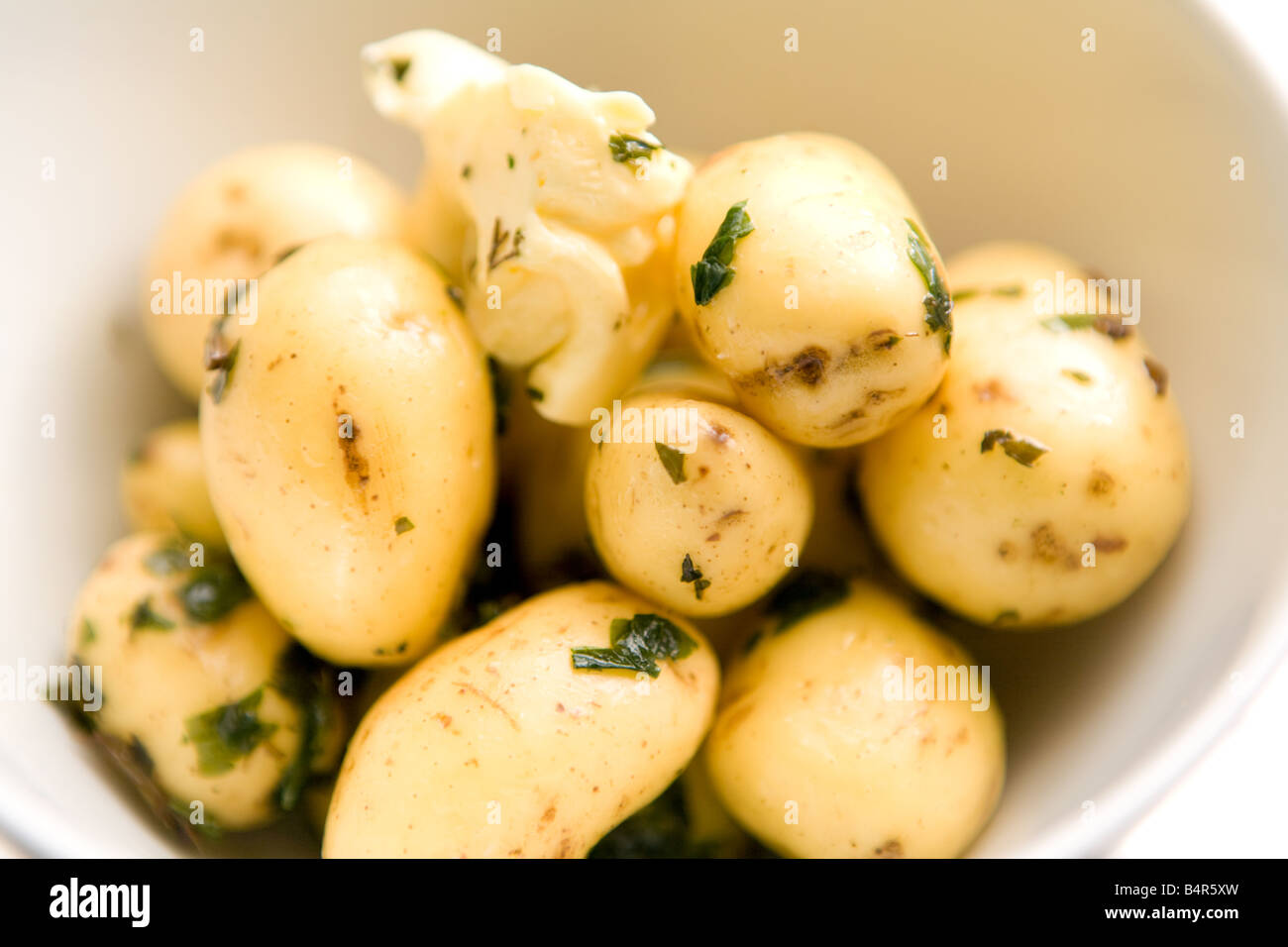 Patate con burro e menta Foto Stock