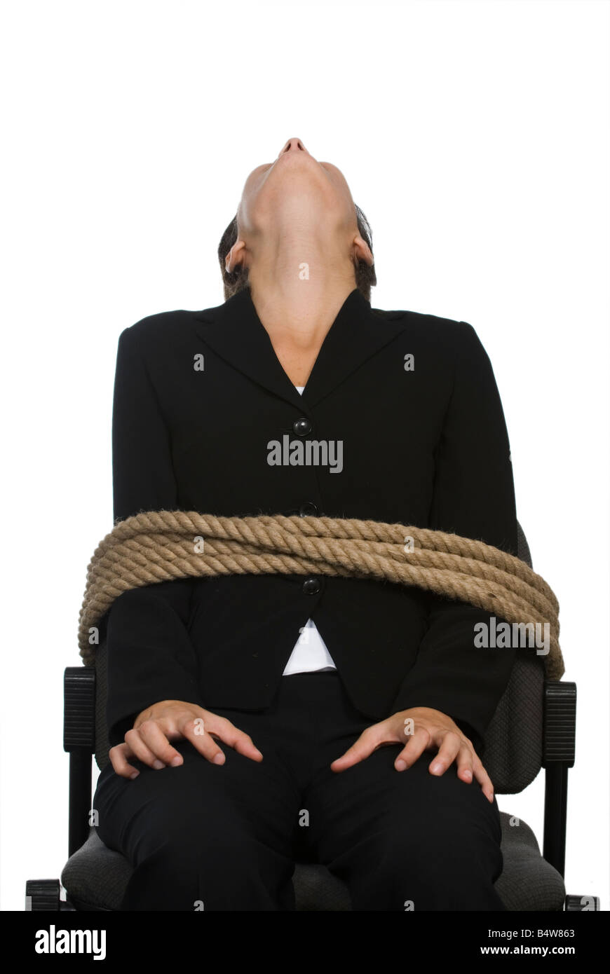 Business donna legato ad una sedia Foto Stock