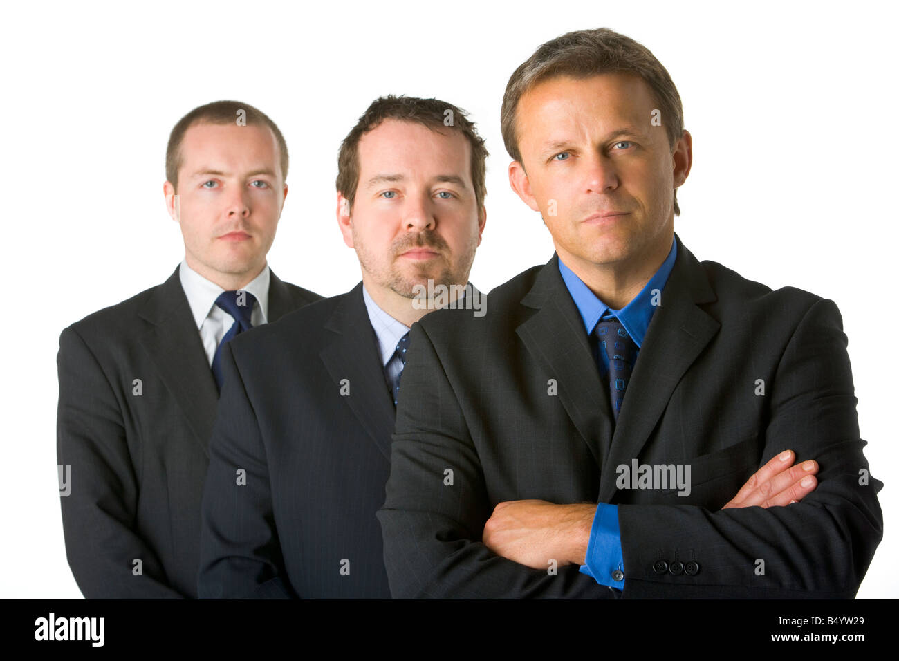 Un gruppo di uomini d'affari in cerca Stern Foto Stock