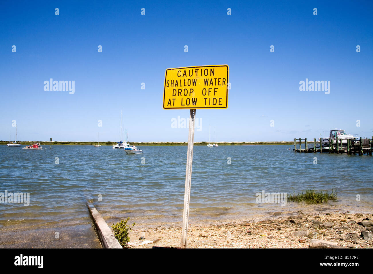 Spia acqua segno accanto ad una spiaggia di accedere a St. Augustine Beach, Florida Foto Stock