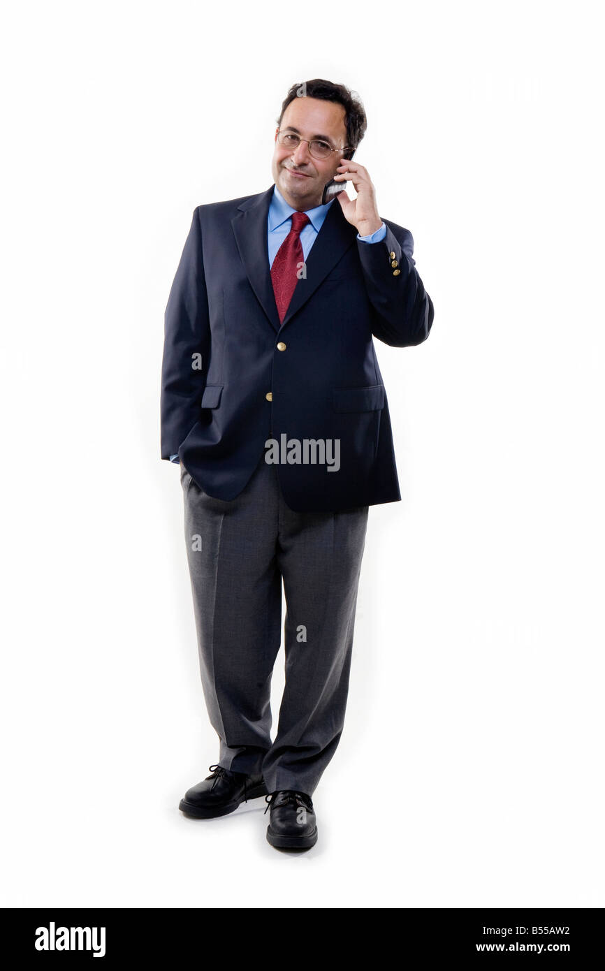 Business man standing a piena lunghezza sul telefono cellulare Foto Stock