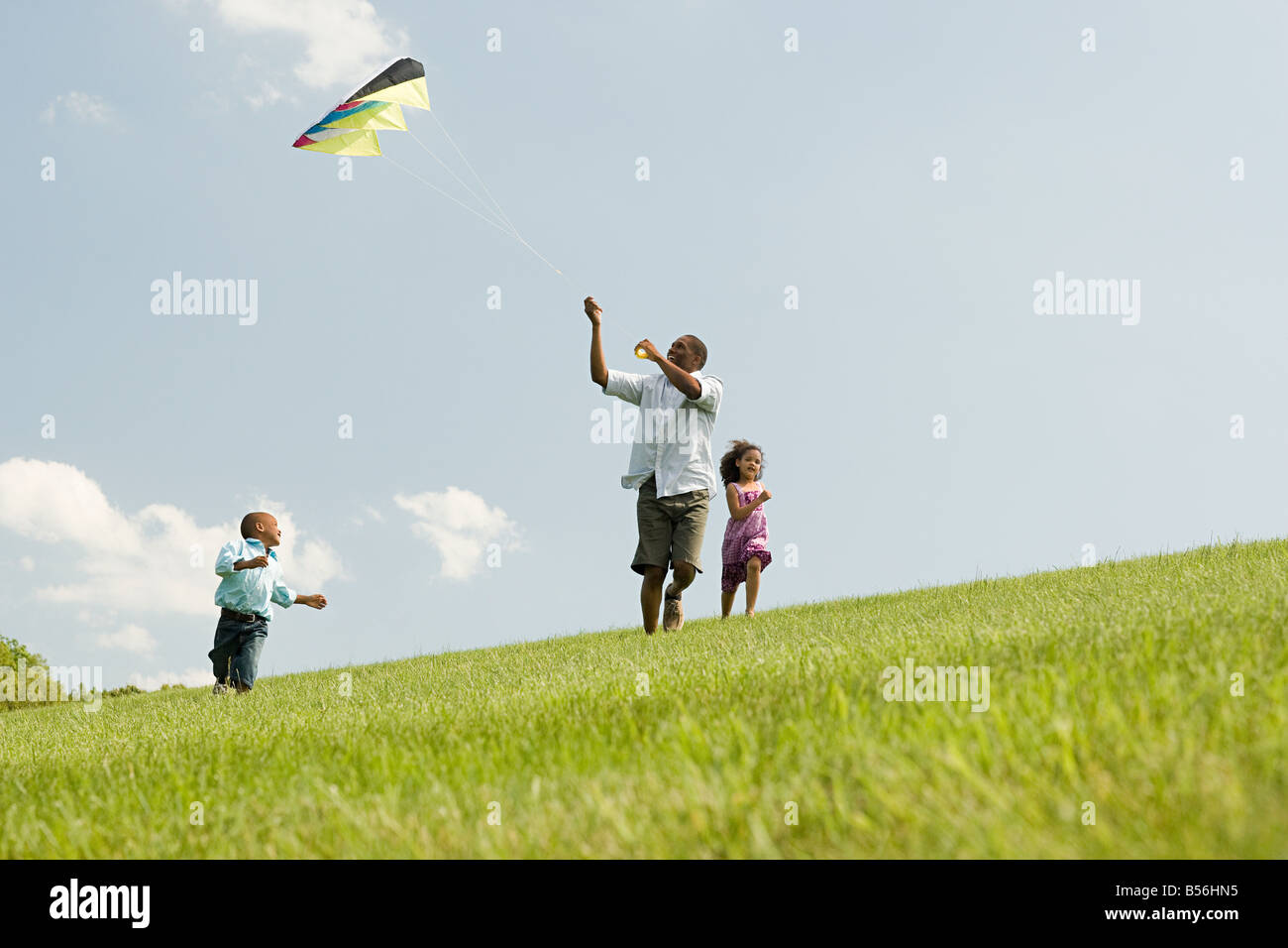 Padre e figli con kite Foto Stock