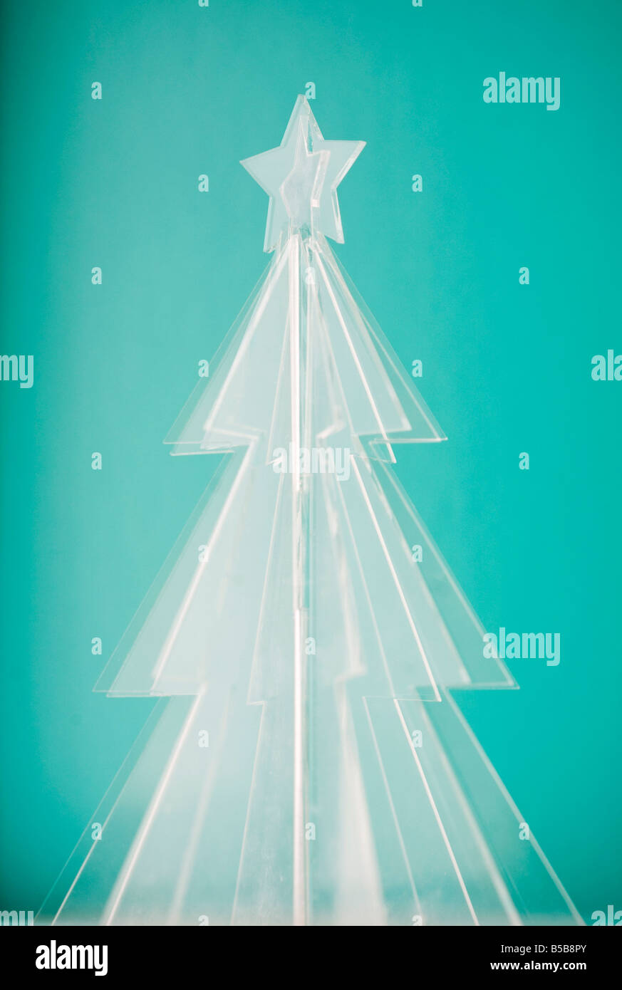 Incandescente icy albero di natale di Tiffany sfondo blu Foto Stock