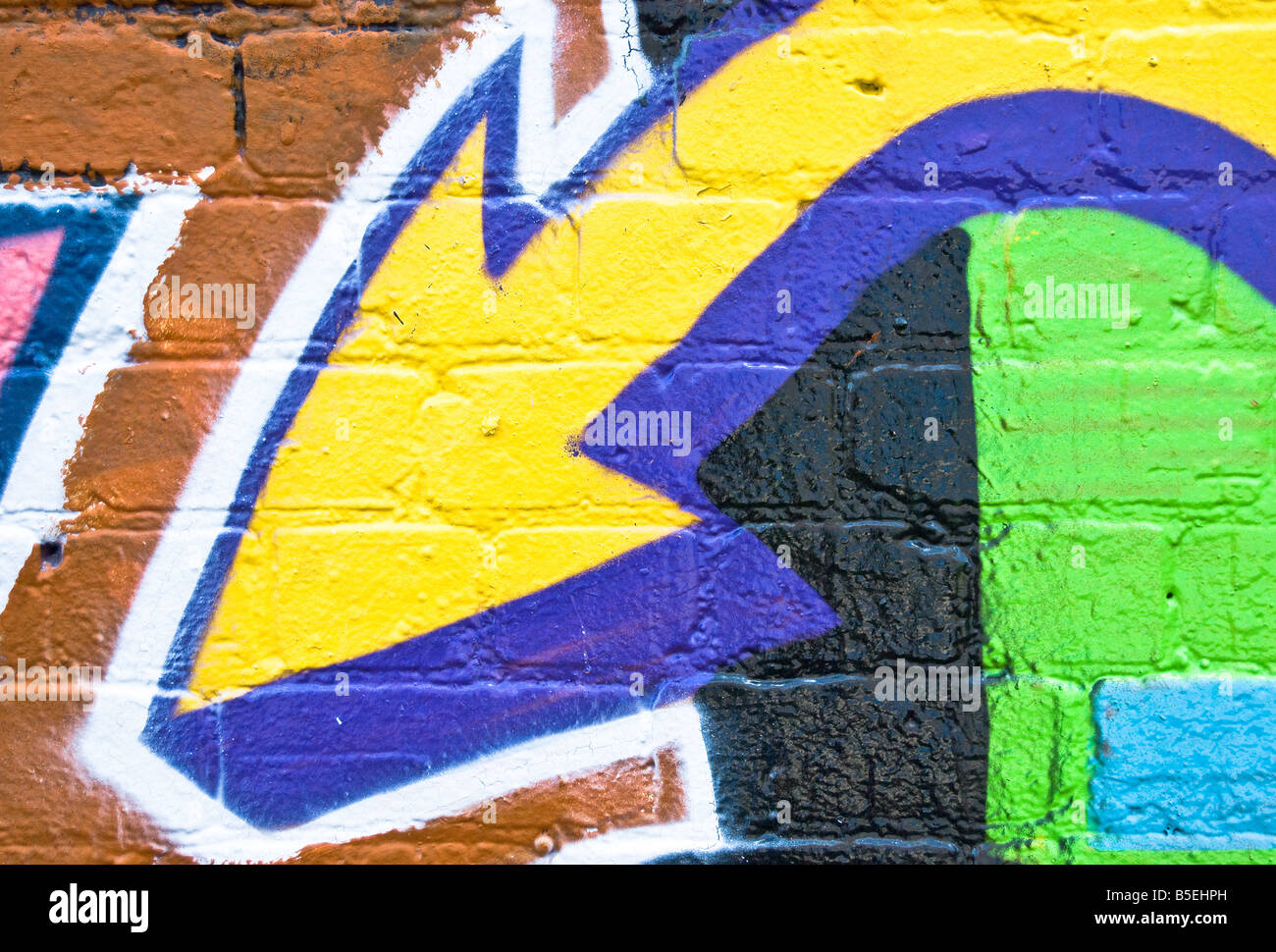 Graffiti freccia sulla trama parete di mattoni Foto Stock
