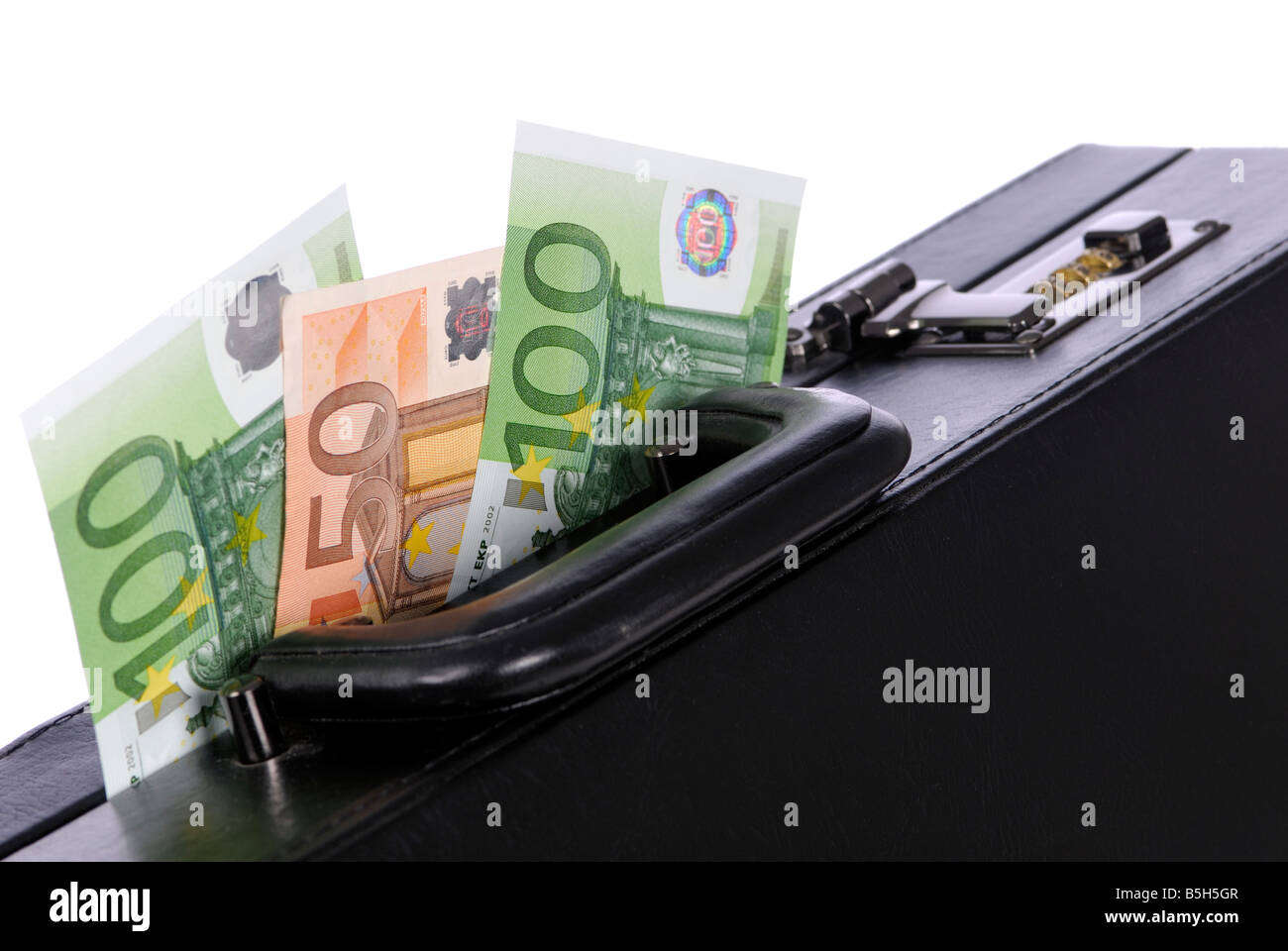 Banconote e una valigetta nera Foto Stock