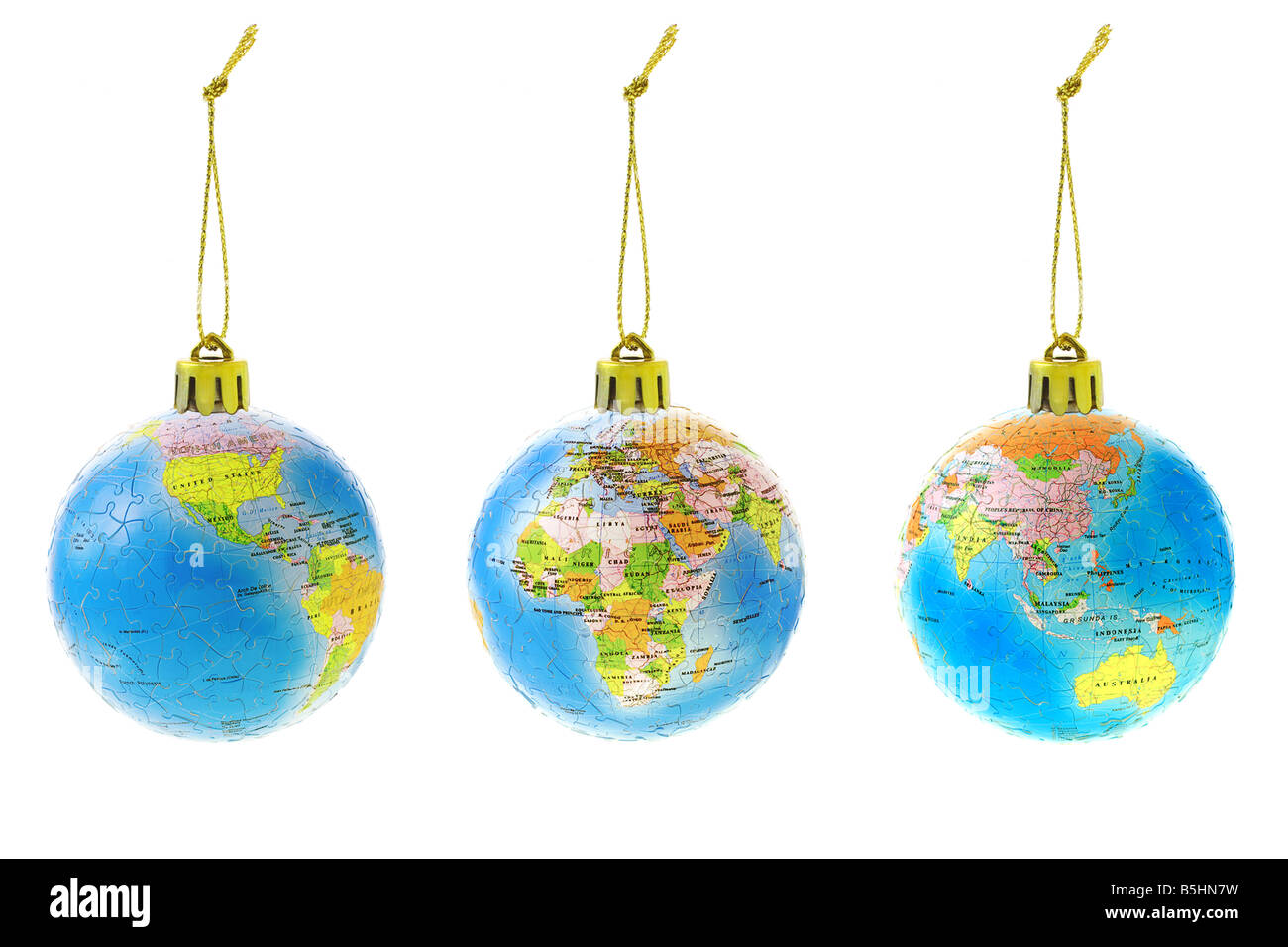 Tre Natale ornamenti globo mostra diversi continenti Foto Stock