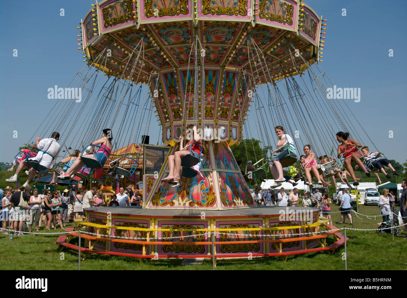Sedia rotatoria di oscillazione in fiera luna park fair ride Cowpie Rally Betchworth Surrey Foto Stock