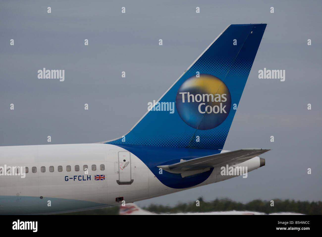 Thomas Cook aeromobile coda con il logo della società,l'aeroporto di Manchester, a nord-ovest, Regno Unito Foto Stock