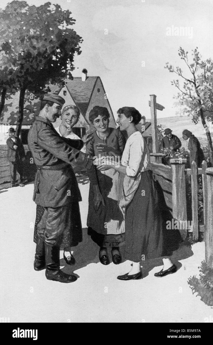 2 G55 P1 1914 35 soldato tedesco donne WWI Cartolina Storia La Prima Guerra Mondiale la propaganda Gruess Gott un soldato tedesco saluta alcuni giovani Foto Stock