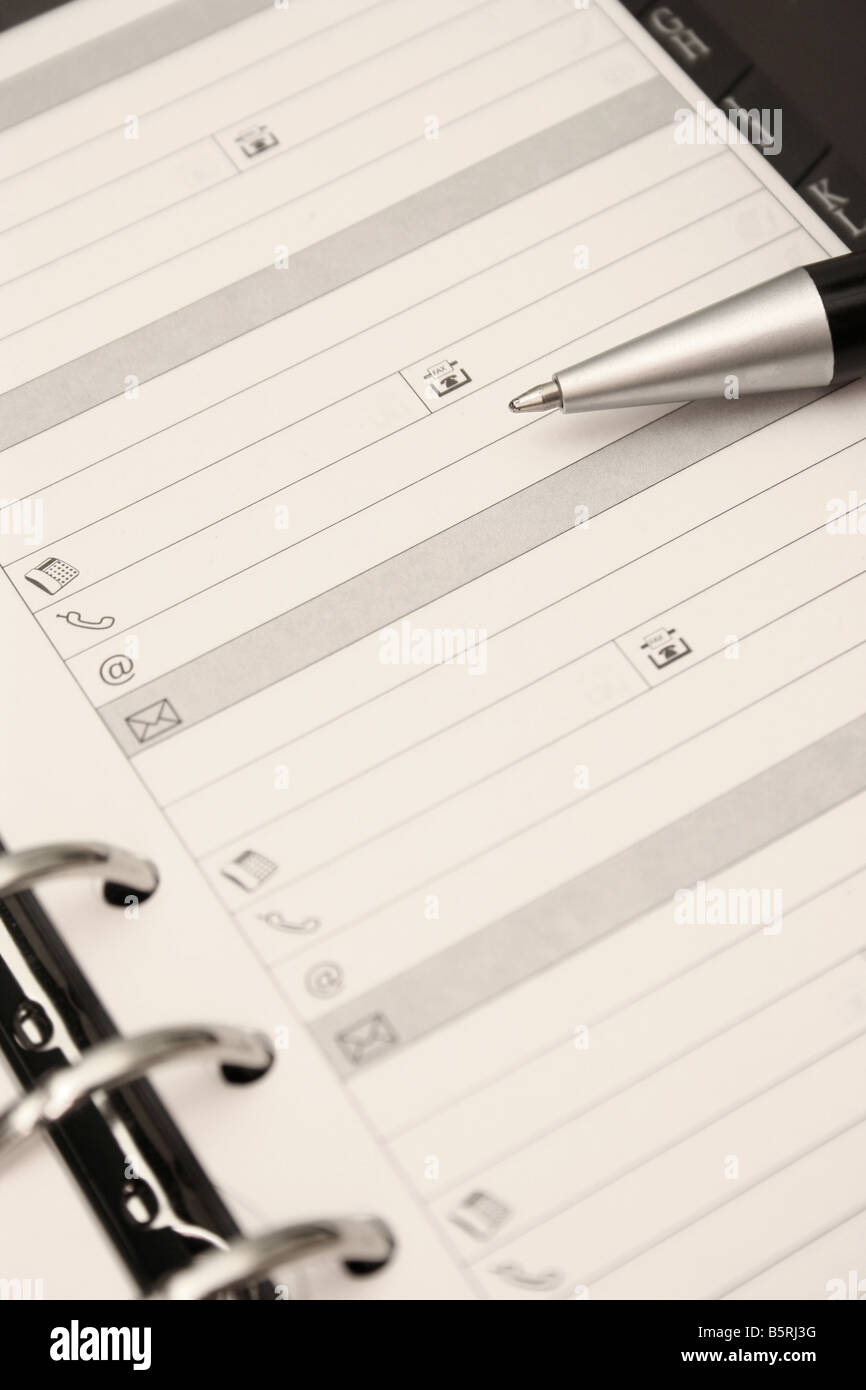Aprire organizer con penna pagina vuota Foto Stock
