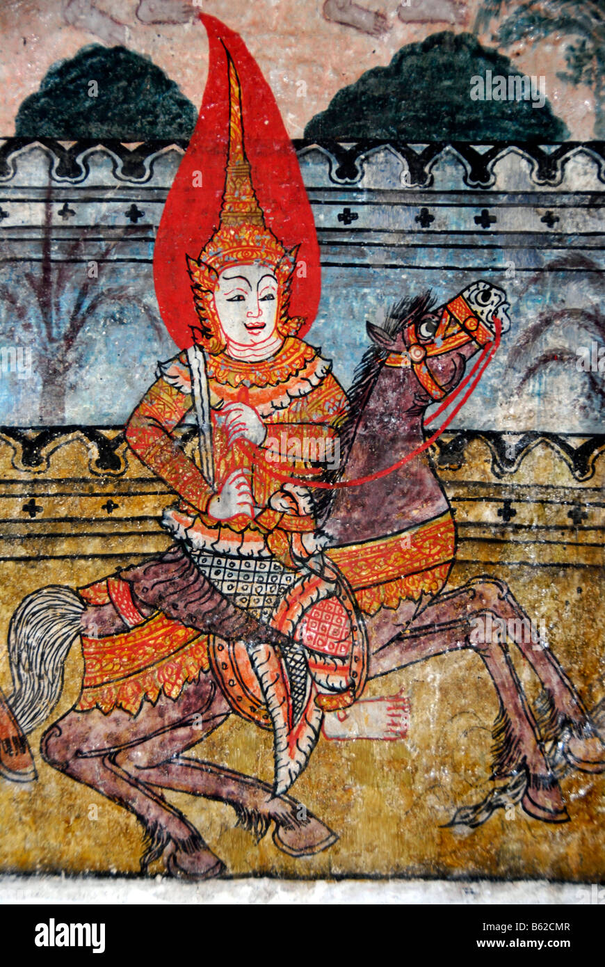 Il vecchio muro buddista pittura, cavaliere illuminato in Wat Pa Huak tempio Phu Si Berg, Luang Prabang, Laos, sud-est asiatico Foto Stock