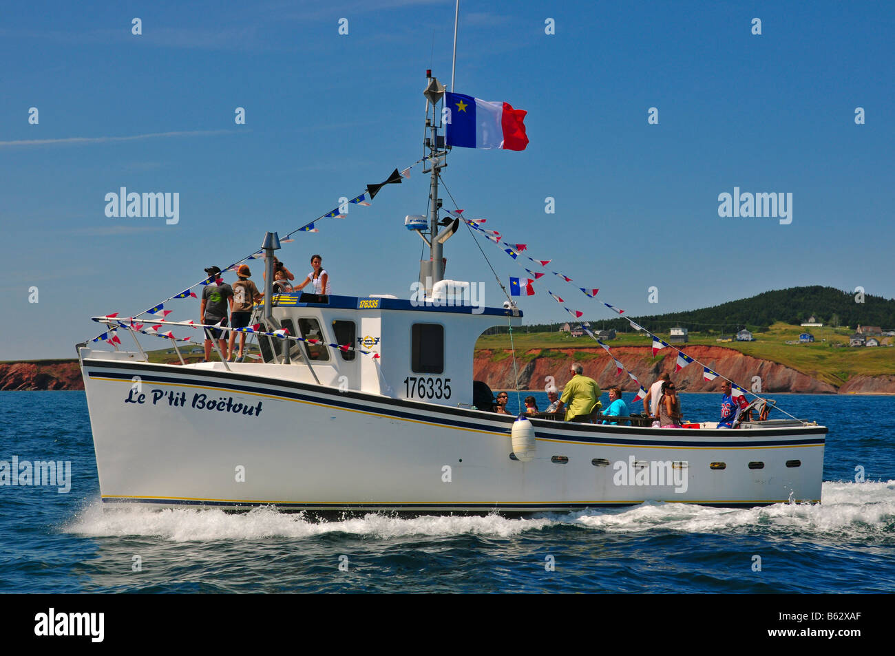 Acadian pescatori alle celebrazioni del giorno su barche a Iles de la Madeleine Québec Canada Foto Stock