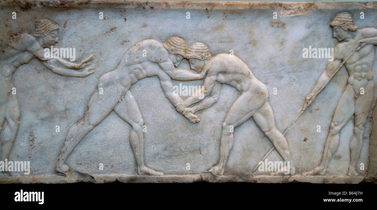 Lottatori di decorazione di sarcofago Greco Atene Grecia Foto Stock