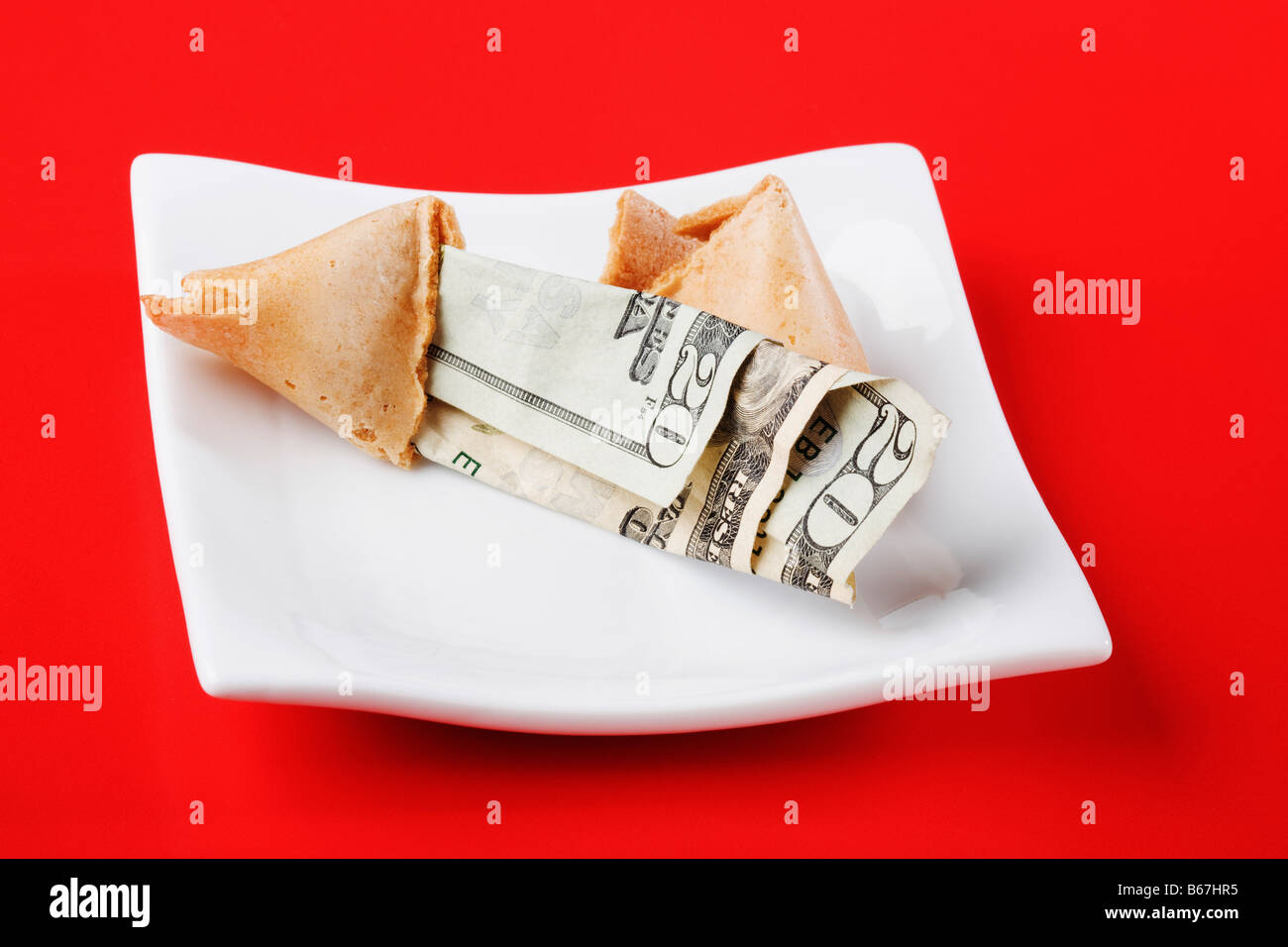 Close-up di venti dollari in un fortune cookie Foto Stock
